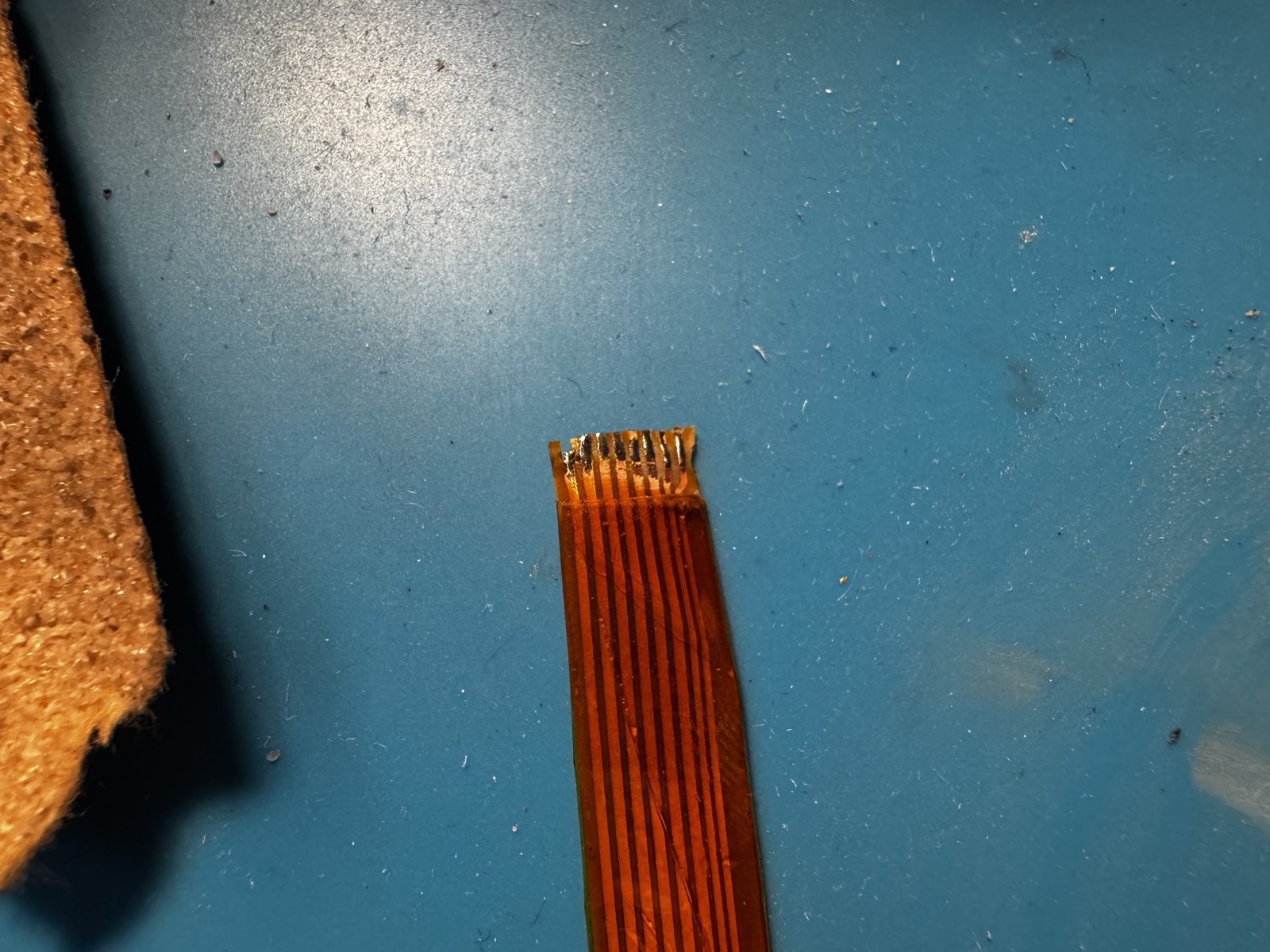 The tinned ends of the flat flex cable