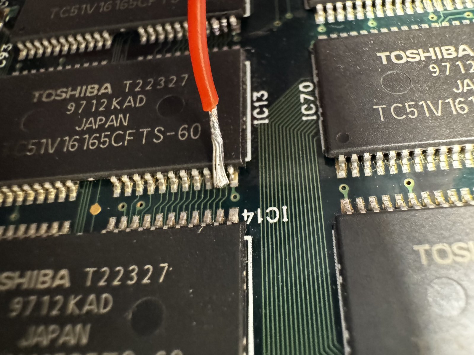 On pin 24 of the RAM chip. It took a few attempts, but the connection is right. On pin 24 of the RAM chip. It took a few attempts, but the connection is right.