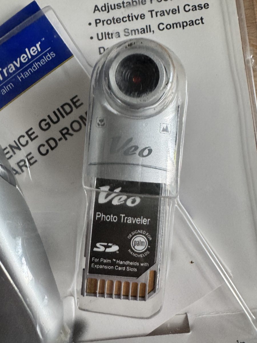 The camera itself: an SD card with a swivel lens for Palm handhelds with an expansion card slot The camera itself: an SD card with a swivel lens for Palm handhelds with an expansion card slot
