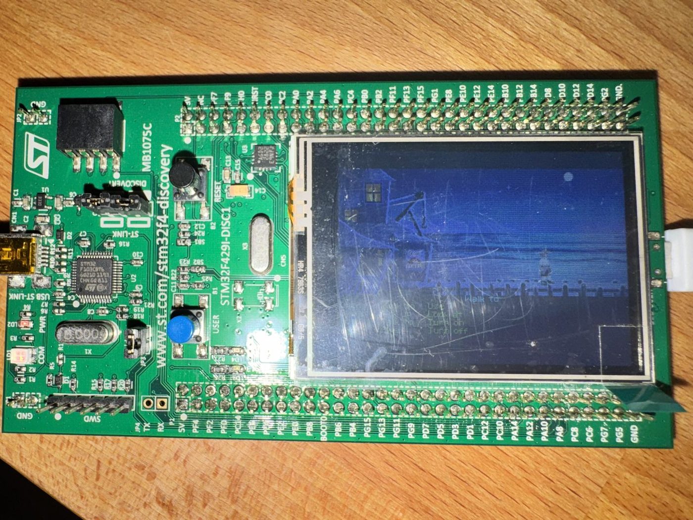 The Discovery board in landscape orientation: ST-LINK connector on the left, blue USER button and black RESET button in the middle The Discovery board in landscape orientation: ST-LINK connector on the left, blue USER button and black RESET button in the middle