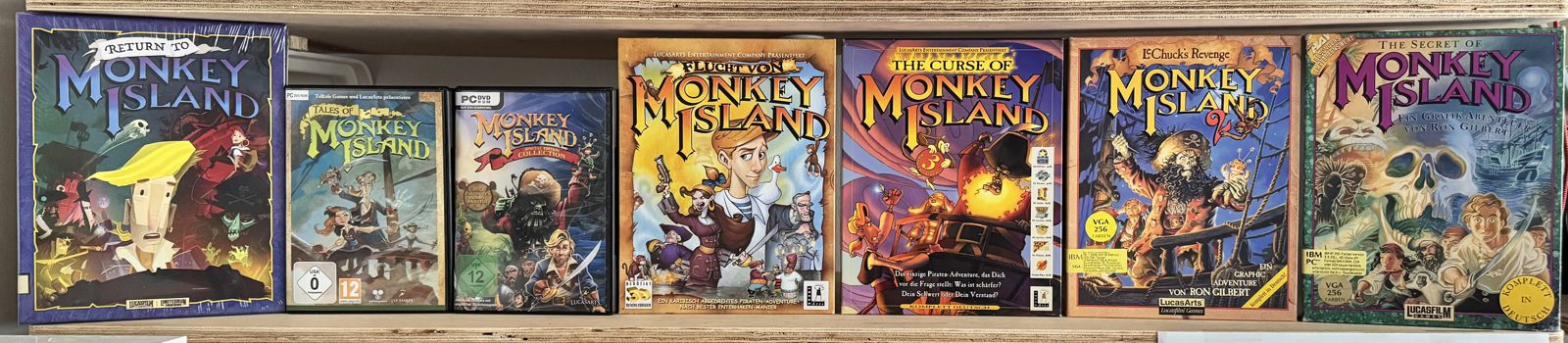 All Monkey Island games in their original boxes on a shelf All Monkey Island games in their original boxes on a shelf