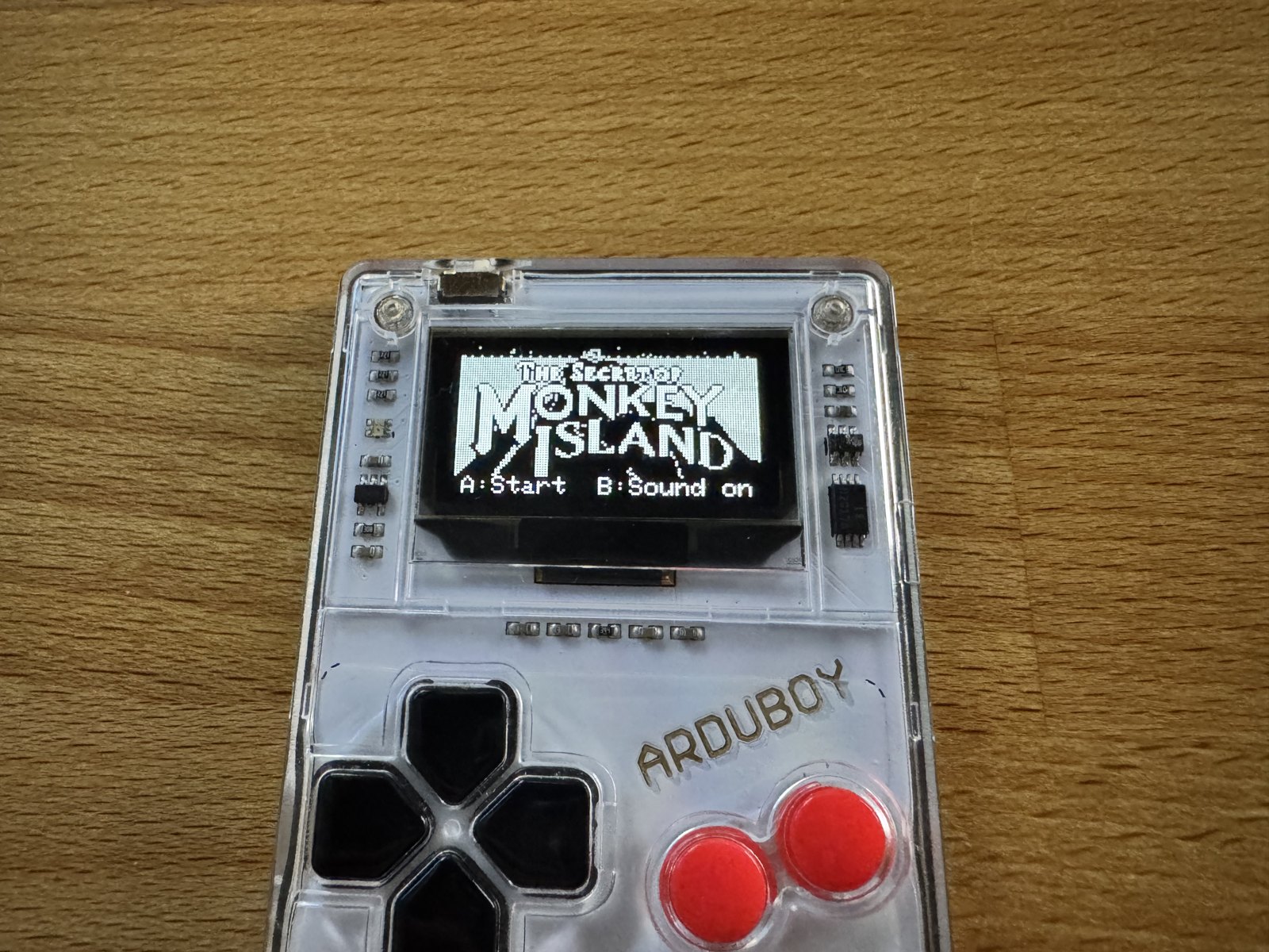 The Arduboy FX with the title screen of The Secret of Monkey Island in four shades of grey The Arduboy FX with the title screen of The Secret of Monkey Island in four shades of grey