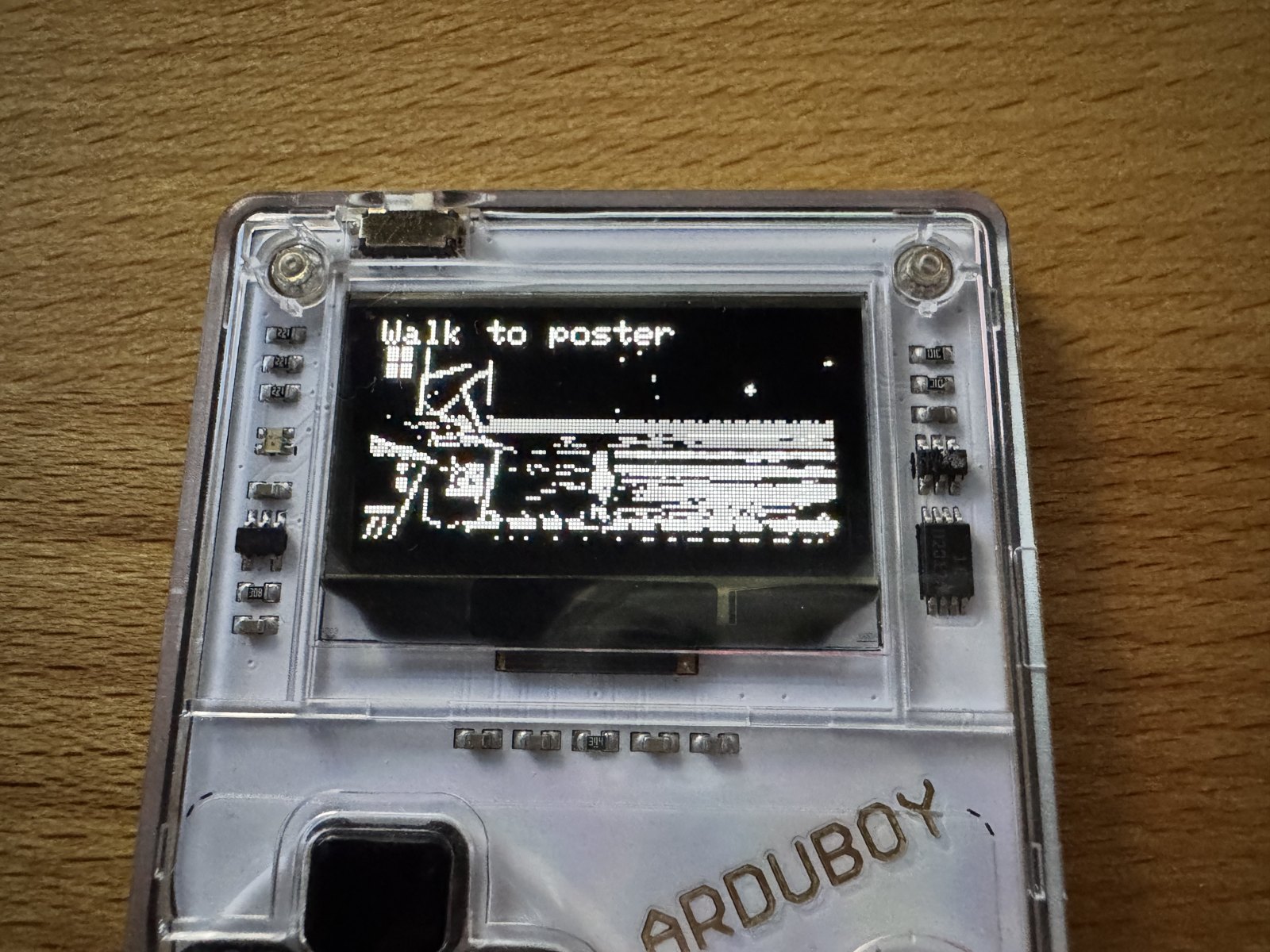 The Arduboy FX showing the dock of Mêlée Island in greyscale The Arduboy FX showing the dock of Mêlée Island in greyscale