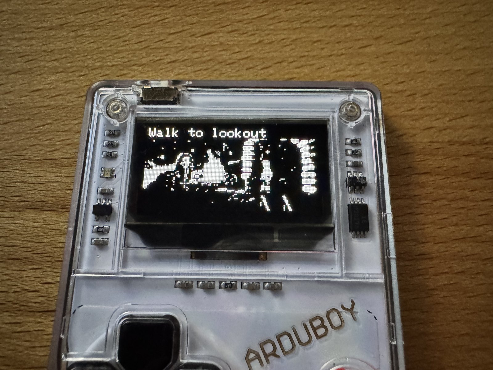 The Arduboy FX showing the lookout point on Mêlée Island in greyscale The Arduboy FX showing the lookout point on Mêlée Island in greyscale