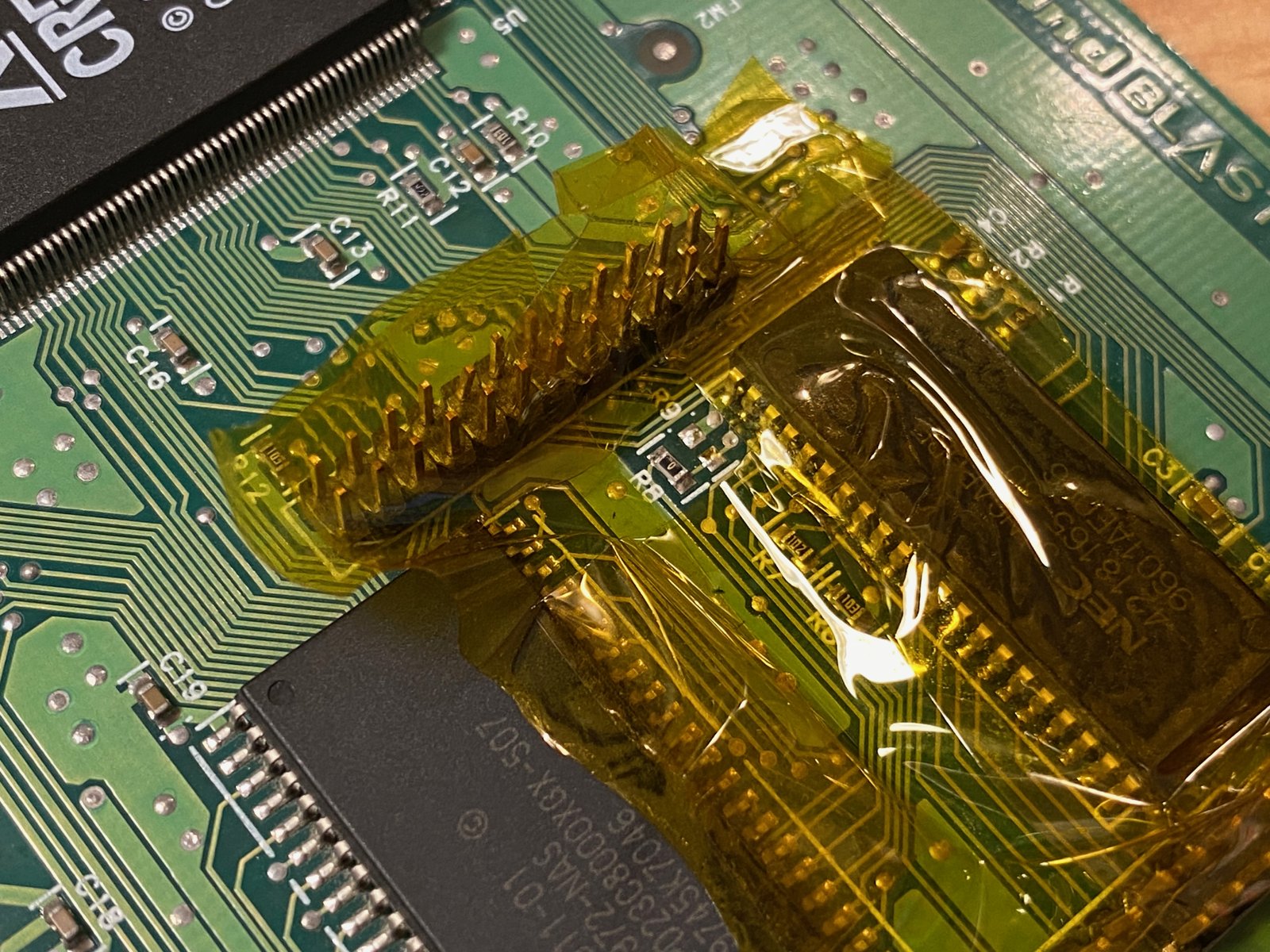 Kapton tape protects the parts around the DRAM chip Kapton tape protects the parts around the DRAM chip